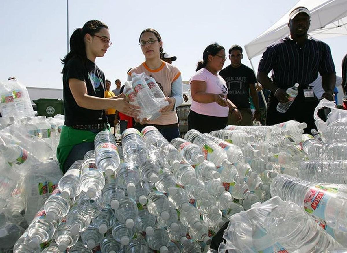 Volunteers prepare to distribute bottles of water in Miami after Wilma hit in 2005. Fortunately, a six-pack didn’t cost $72