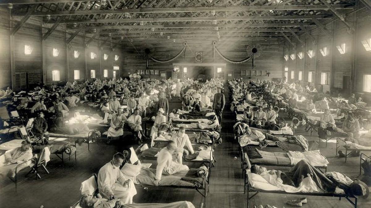 Beds with patients in an emergency hospital in Camp Funston, Kansas, during the influenza epidemic around 1918.