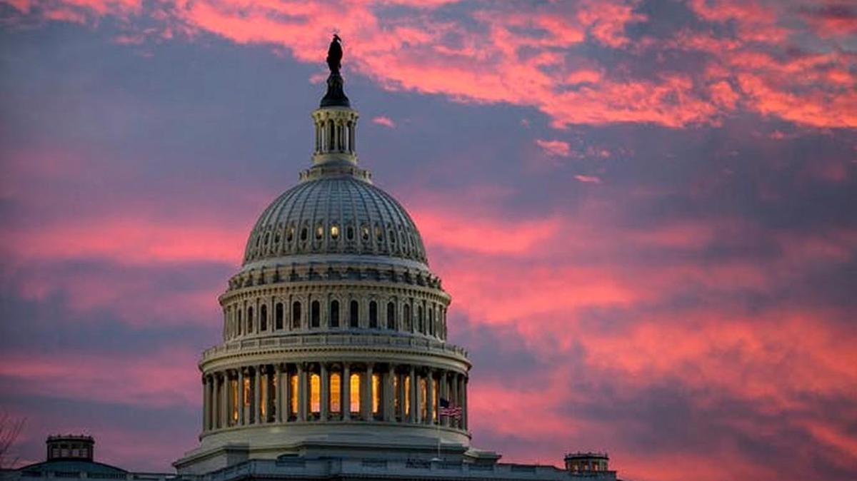 The Capitol is lit up at dawn on Nov. 30, 2017 as Senate Republicans work to pass their sweeping tax bill.