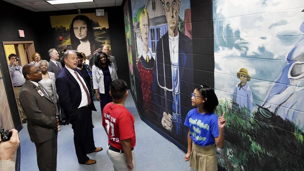 Sean Covey from The Leader in Me gets a tour of Carter Elementary by fifth-graders Landon Diaz and Chloe Andayan on Thursday morning.