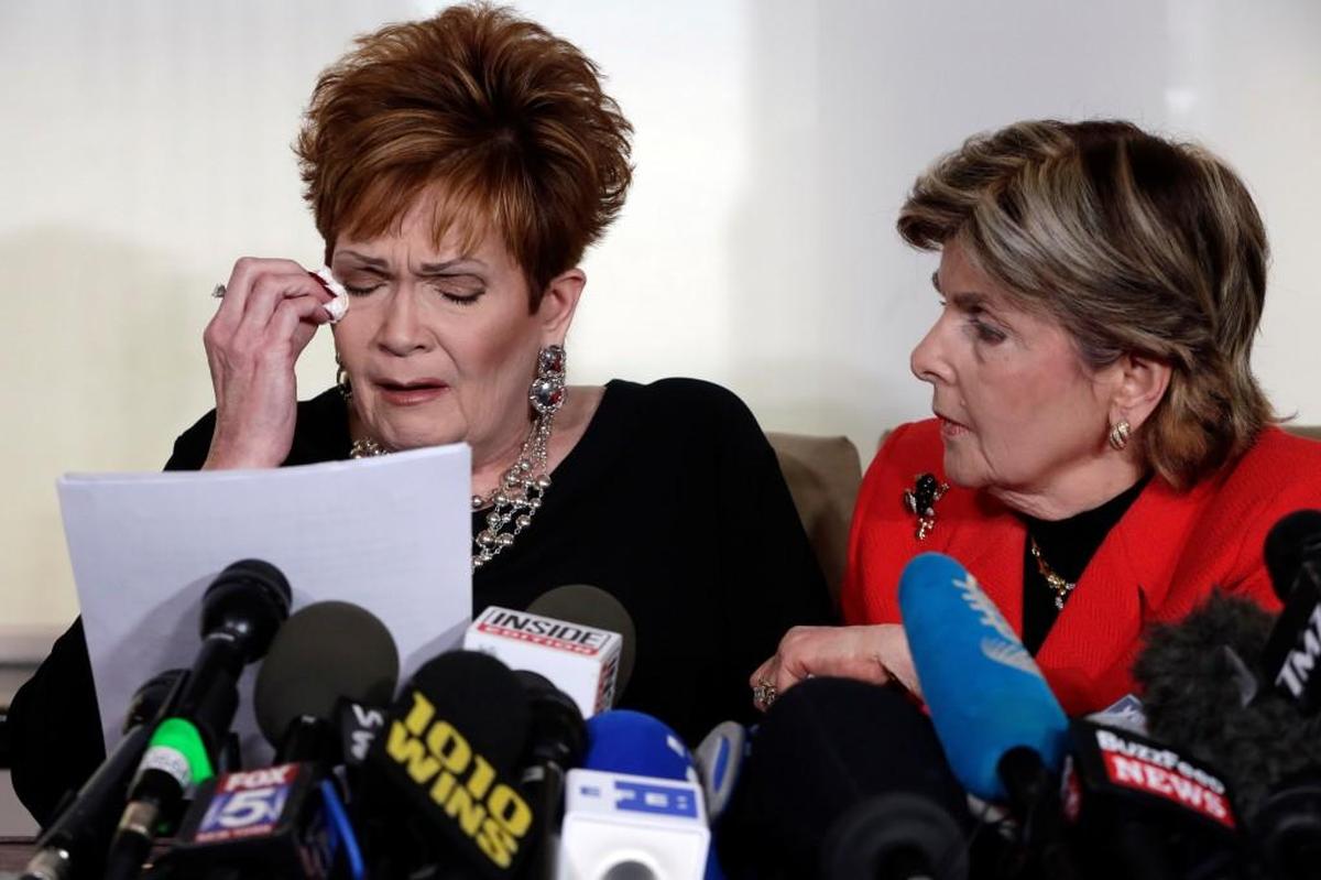 Beverly Young Nelson, left, the latest accuser of Alabama Republican Roy Moore, reads her statement as attorney Gloria Allred looks on, at a news conference, in New York, Monday, Nov. 13, 2017. Nelson says Moore assaulted her when she was 16 and he offered her a ride home from a restaurant where she worked. Moore says the latest allegations against him are a "witch hunt."