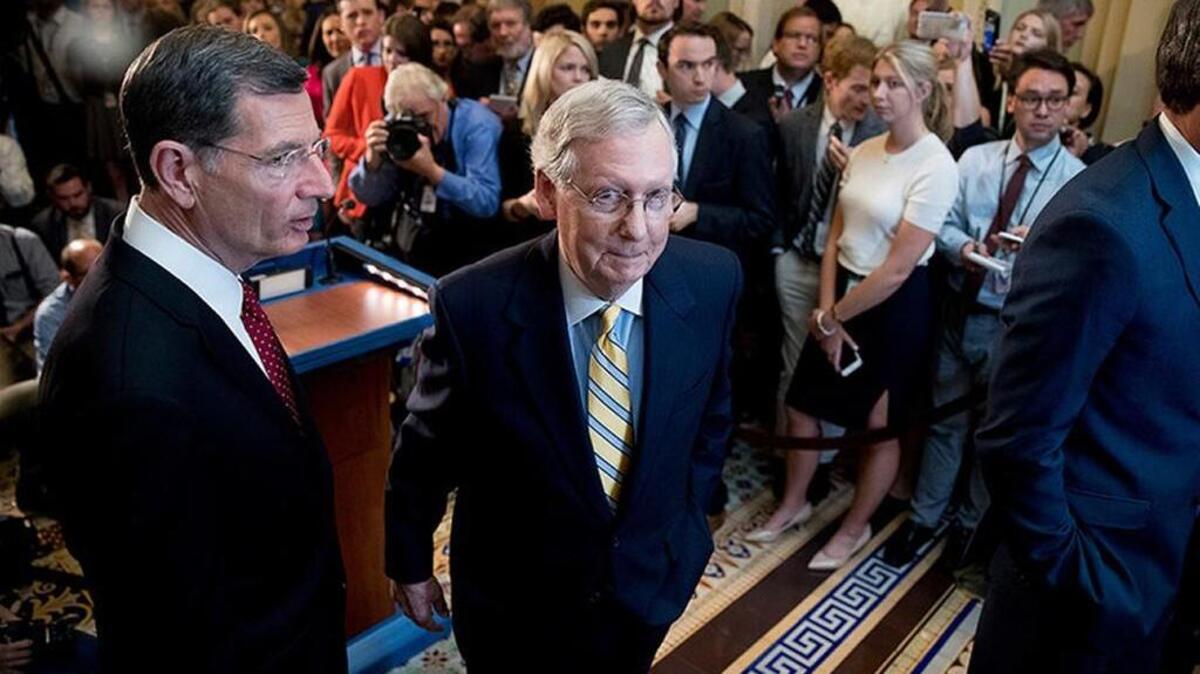 Senate Majority Leader Mitch McConnell, middle, on June 27 announced he was delaying a vote on the Republican health care bill.