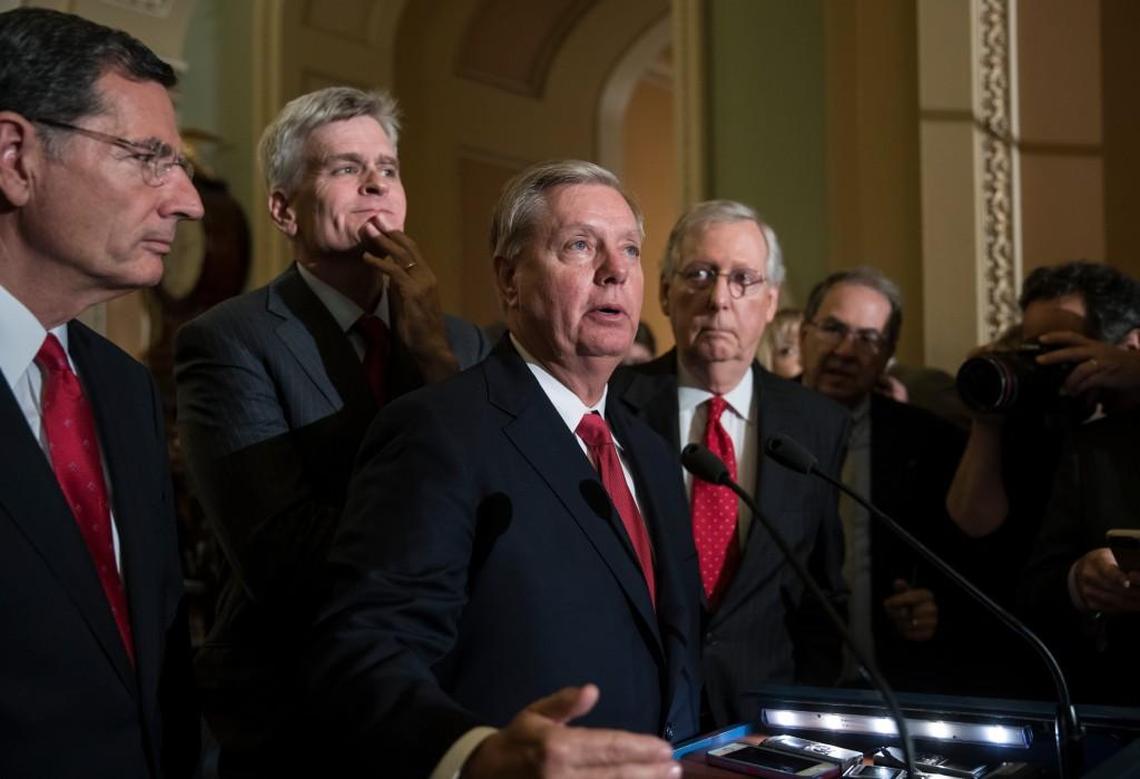 Sen. Lindsey Graham, R-S.C., center, joined by, from left, Sen. John Barrasso, R-Wyo., Sen. Bill Cassidy, R-La., and Senate Majority Leader Mitch McConnell, R-Ky., talks to reporters as they face assured defeat on the Graham-Cassidy bill, the GOP's latest attempt to repeal the Obama health care law, at the Capitol in Washington, Tuesday, Sept. 26, 2017. The decision marked the latest defeat on the issue for President Donald Trump and Senate Majority Leader Mitch McConnell in the Republican-controlled Congress.