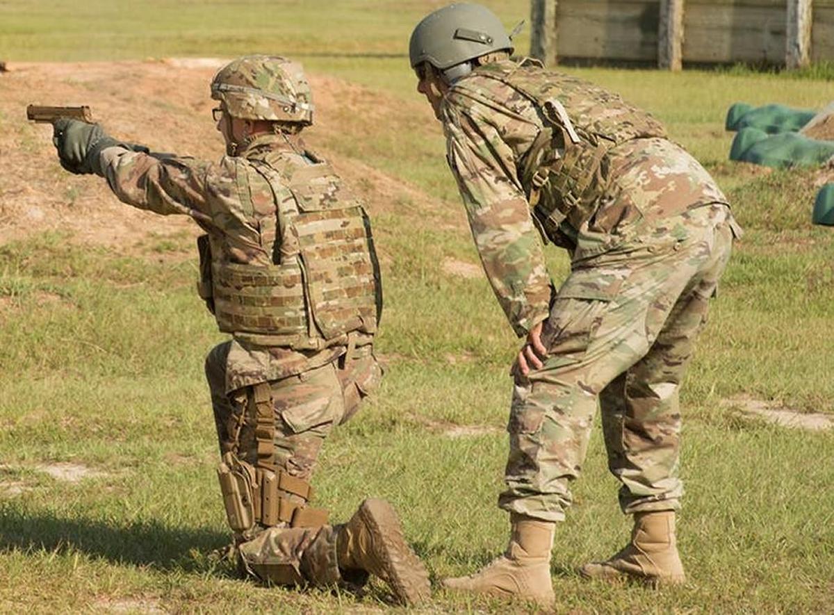 A soldier fires the Sig Sauer P320, which the Army has chosen as its new standard pistol.
