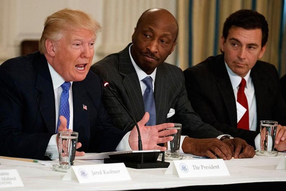 Merck CEO Kenneth Frazier, center, resigned from Trump’s manufacturing council because of the president’s muted reaction to the violence in Charlottesville, Va. The council soon disbanded after that.