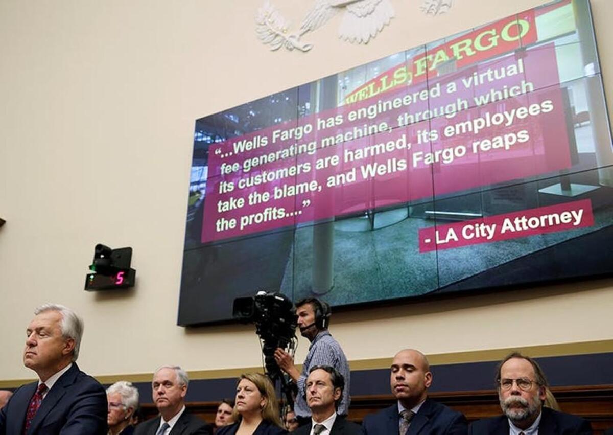 John Stumpf, far left, lost his job as CEO of Wells Fargo as a result of the scandal over fraudulent accounts.
