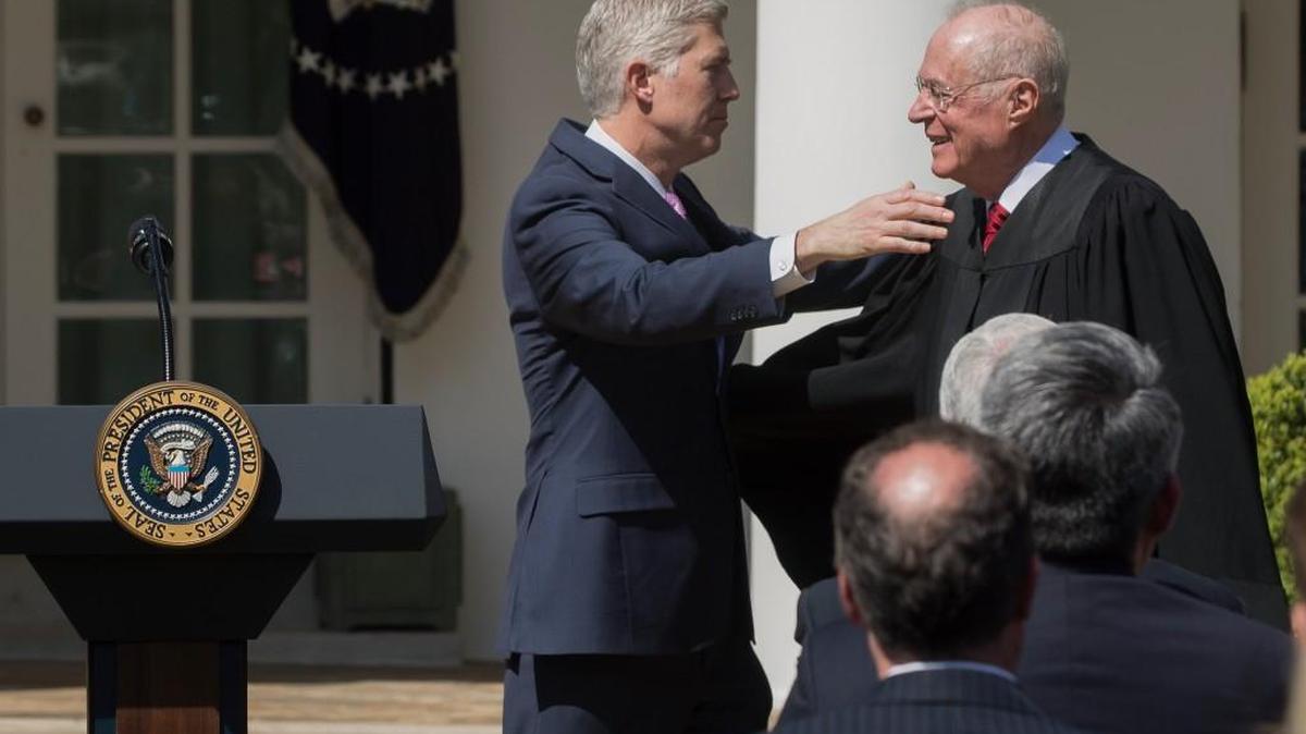 Supreme Court Justice Anthony Kennedy, right, administers an oath of office to Justice Neil Gorsuch, at the Rose Garden of the White House in Washington on April 10, 2017.