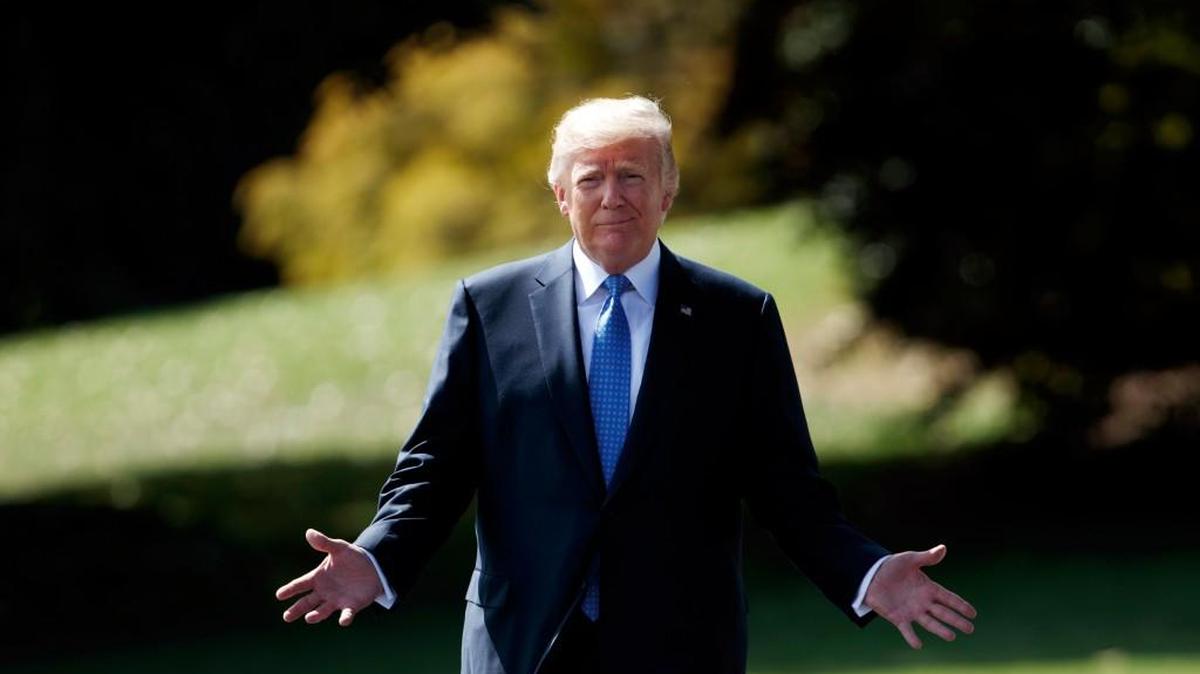 President Donald Trump walks to speak to reporters as he walks to board Marine One on the South Lawn of the White House, Wednesday, Sept. 27, 2017, in Washington.
