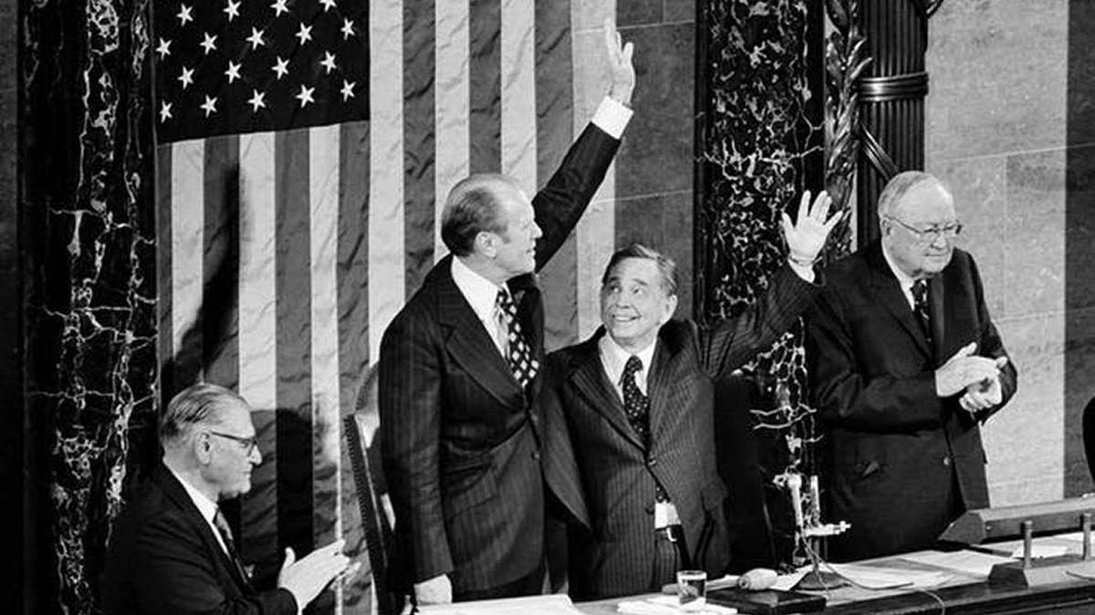 Gerald Ford, left, and Carl Albert wave on Dec. 6, 1973, just after Ford was sworn in as vice president.
