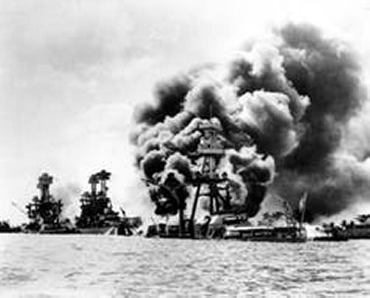 Three U.S. battleships are hit from the air during the Japanese attack on Pearl Harbor on Dec. 7, 1941.