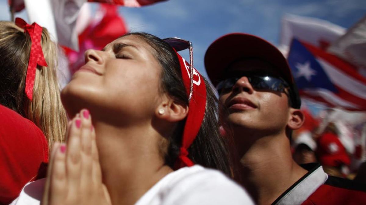 Puerto Rican citizen gestures during political rally in 2012.