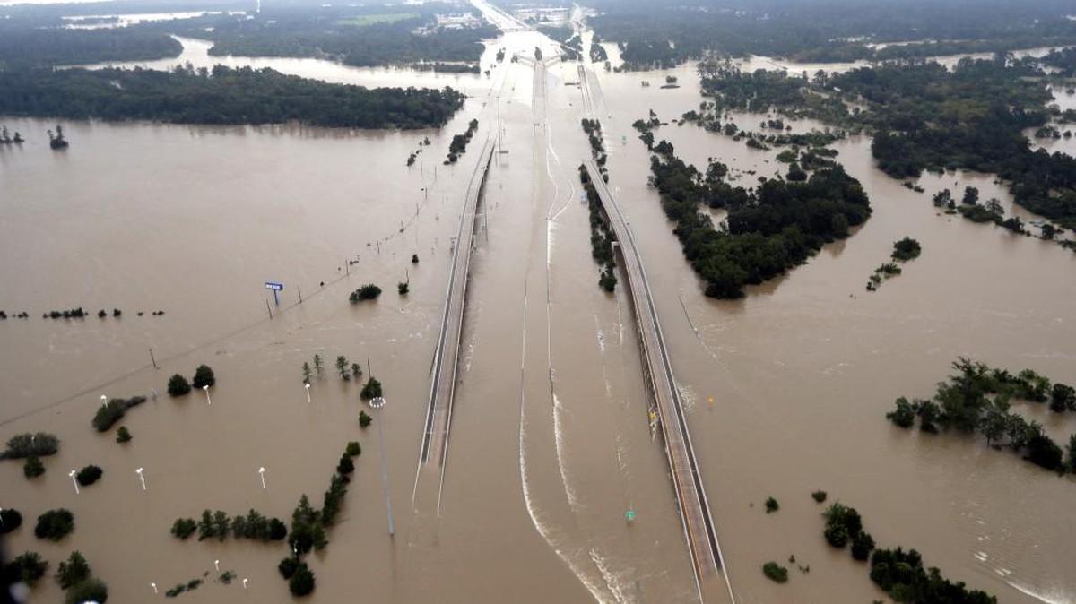 Interstate 69 is covered by floodwaters from Harvey, in Humble, Texas. Just two weeks ago, President Donald Trump rolled back an order by his predecessor that would have made it easier for storm-ravaged communities to use federal emergency aid to rebuild bridges, roads and other construction so they can better withstand future disasters. That decision is now being questioned with the Texas Gulf Coast and much of Houston under water in the wake of Harvey.