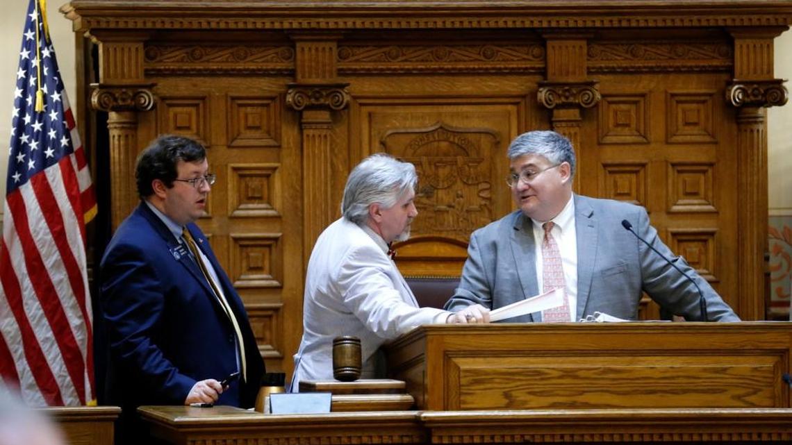 Georgia state Sen. David Shafer, R-Duluth, right, speaks with Sen. Josh McKoon, R-Columbus, left, and Sen. Greg Kirk, R-Americus, during a 2016 meeting of the General Assembly.