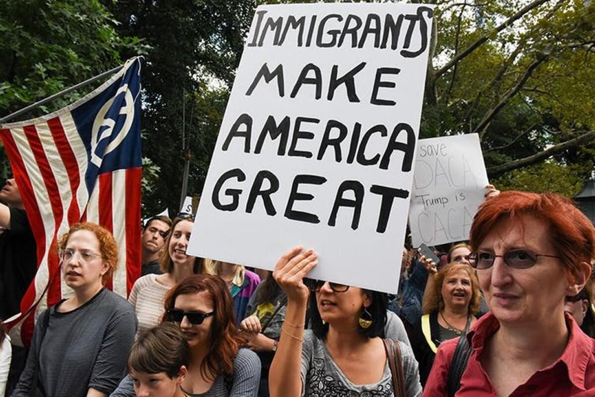 People participate in a protest in defense of the Deferred Action for Childhood Arrivals program, or DACA, in New York.