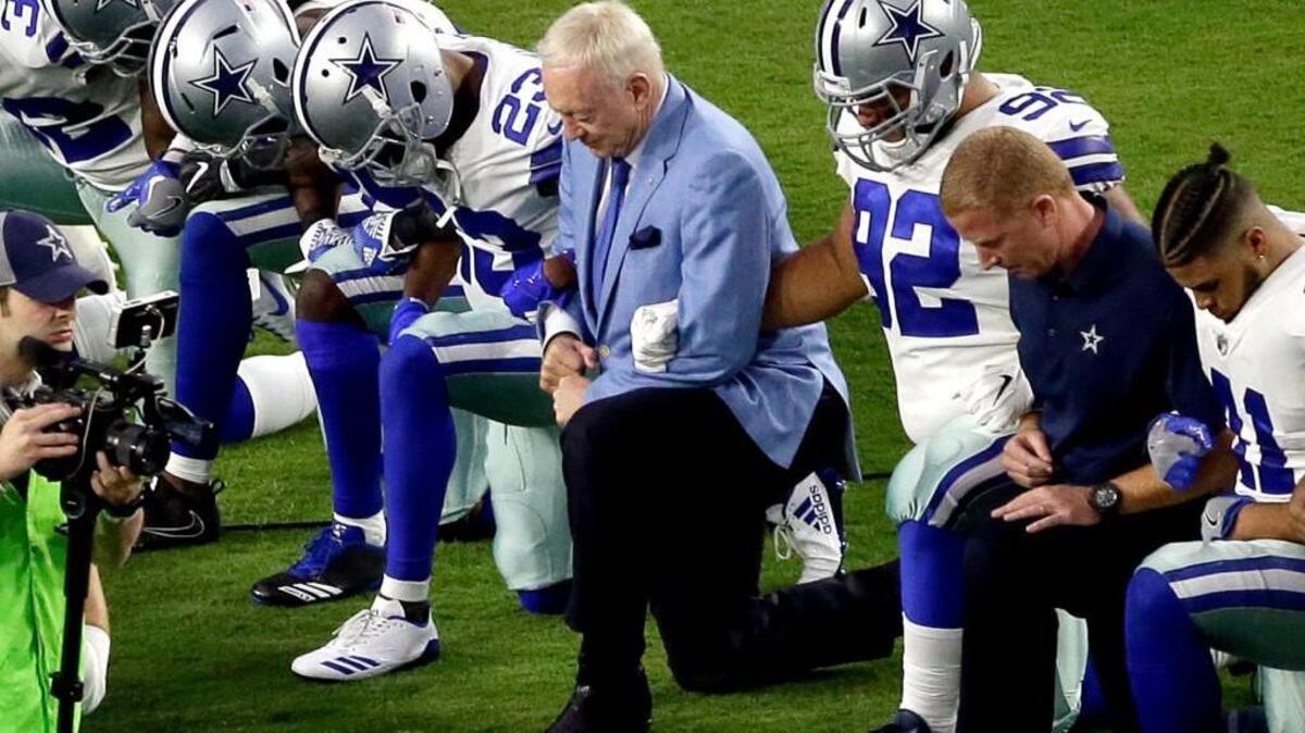 Dallas Cowboys owner Jerry Jones joined his team in taking a knee before a game on Sept. 25.