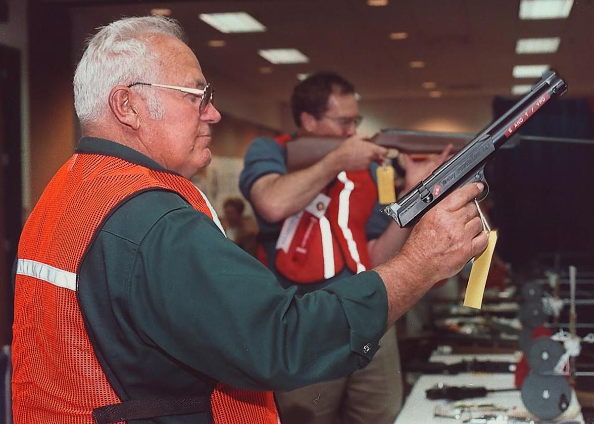 National Rifle Association volunteer shooting instructors Vern Marion of Elko, Nev., front, and Brian Beck of Lomita, Calif., fire at targets on the air gun shooting range at the NRA Convention in Reno, Nev. in 2016.