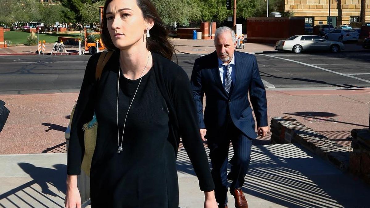 Laney Sweet, left, widow of Daniel Shaver, arrives at Maricopa County Superior Court with attorney Mark Geragos, right, for the opening statements in the trial of former Mesa, Ariz., police officer Philip Brailsford, charged with murder in the fatal 2016 shooting of the unarmed Shaver, Wednesday, Oct. 25, 2017, in Phoenix.