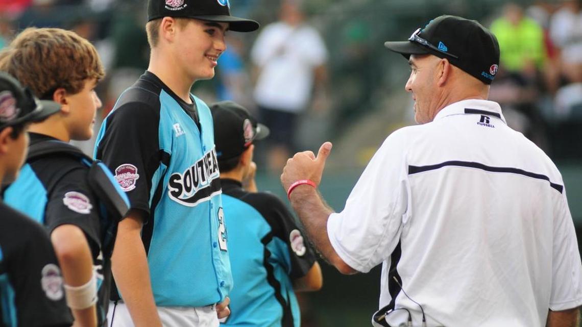 Jake Fromm smiles at a thumbs up from coach Buddy Deal, right, after winning a nine-inning slog against the Great Lakes team from La Grange, Kentucky in the Little League World Series in 2011. Fromm will lead UGA at quarterback in the college football national championship game Monday.