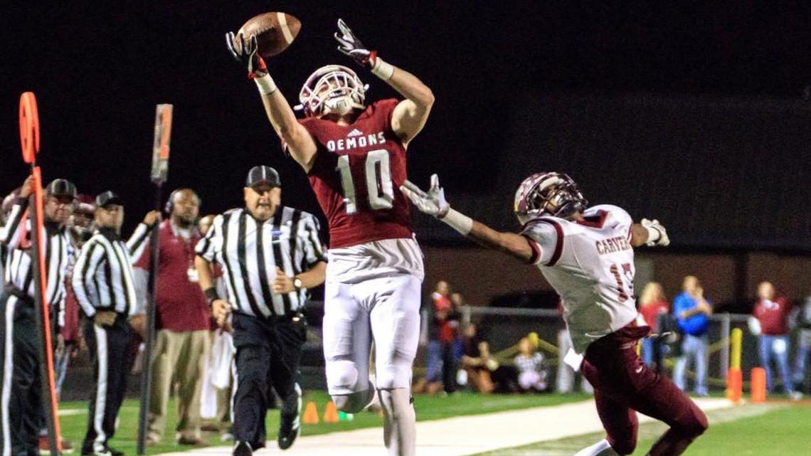 Warner Robins receiver Tyler Fromm (10) catches a pass on the sideline in the GHSA Class 5A semifinal game against Carver-Atlanta on Dec. 1. The Demons take on Rome for the state title Friday.