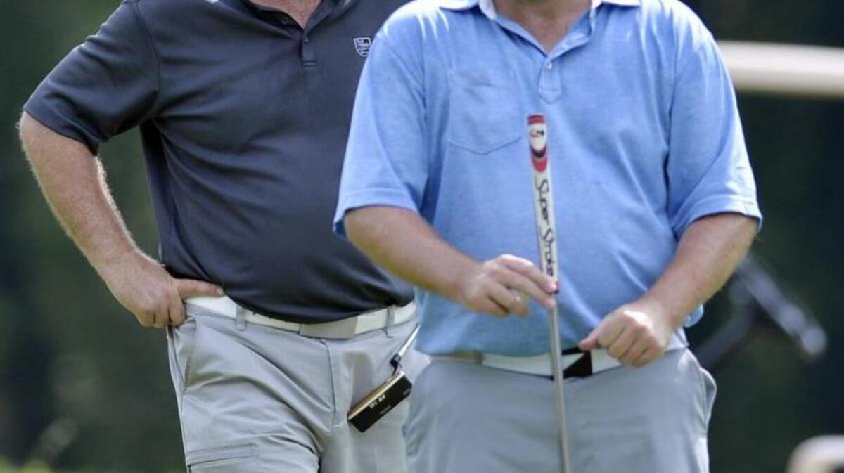 BEAU CABELL/THE TELEGRAPH Macon, Ga., 05/01/2016: Shawn Hodge, left, and partner Stan Gann, Jr., line things up on the ninth green during the final round of the Peach Blossom Golf Tournament.