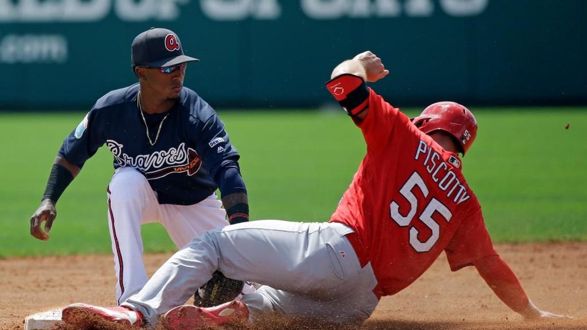 Atlanta Braves infielder Ozzie Albies, left, tags out St. Louis Cardinals' Stephen Piscotty (55) on a steal attempt in the third inning of a 2016 spring training baseball game. He is among a pool of young talent expected to see a lot of playing time for the Braves this year.