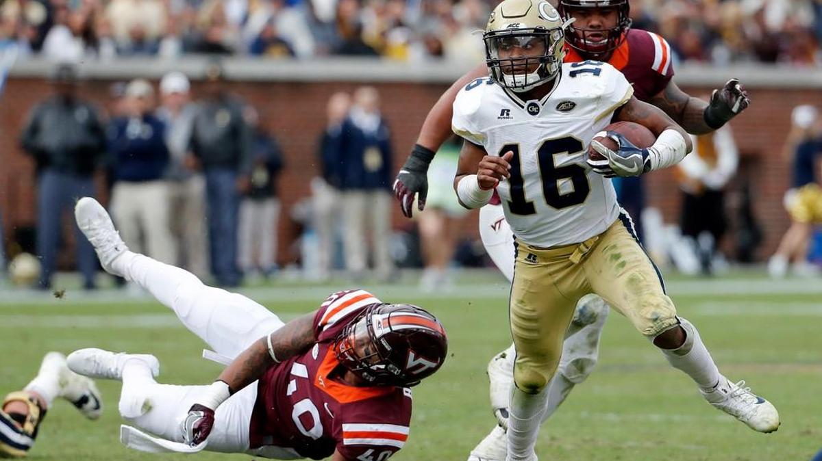 Georgia Tech quarterback TaQuon Marshall, right, runs past Virginia Tech’s Emmanuel Belmar, left, in their game in Atlanta on Nov. 11.