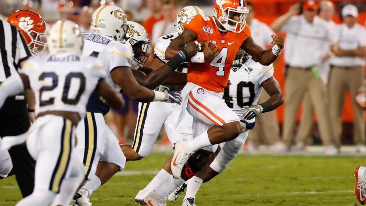 Clemson quarterback Deshaun Watson (4) breaks through the Georgia Tech line in the first half Thursday in Atlanta.
