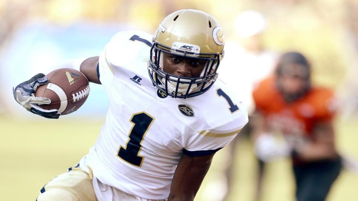 Georgia Tech’s Qua Searcy (1) fights off a Mercer defender for a first-down run during Saturday’s game.