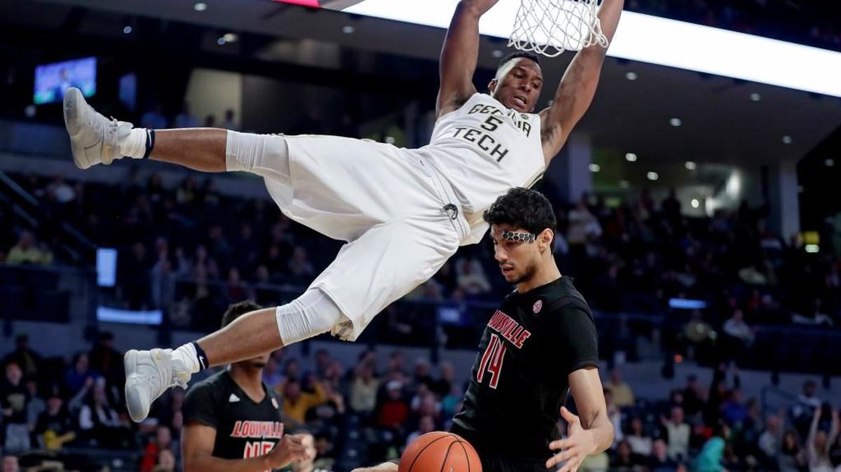 Georgia Tech's Josh Okogie, top, dunks over Louisville's Anas Mahmoud during the second half Saturday’s game at McCamish Pavilion. Louisville won 65-50.
