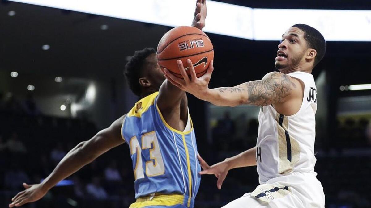Georgia Tech's Tadric Jackson, right, puts up a shot against Southern's Josh Robinson last season.