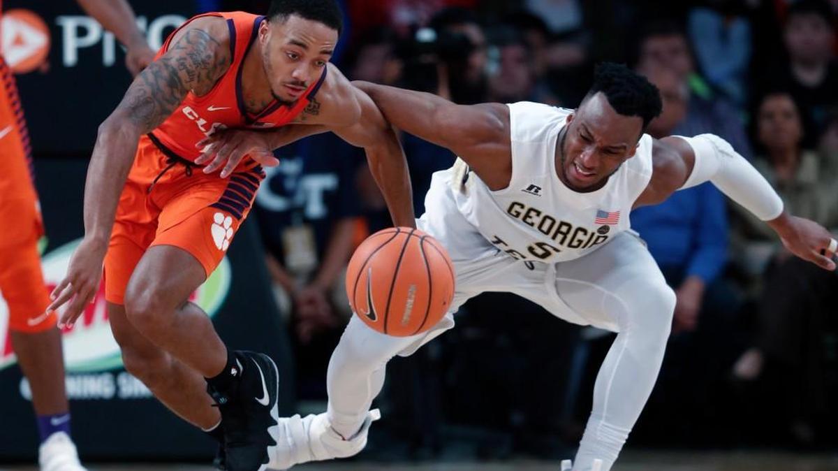 Clemson guard Marcquise Reed (2) steals the ball from Georgia Tech guard Josh Okogie (5) in the second half of an NCAA college basketball game Sunday, Jan. 28, 2018, in Atlanta. Clemson won 72-70.