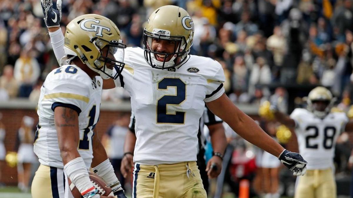 Georgia Tech's Ricky Jeune, right, congratulates quarterback TaQuon Marshall after Marshall ran the ball for a touchdown in the first quarter of an NCAA college football game against Virginia Tech in Atlanta, Saturday, Nov. 11, 2017.