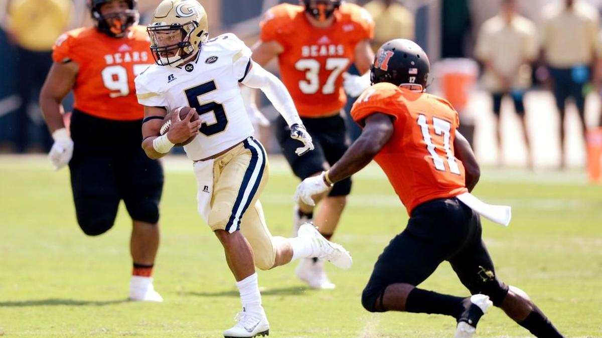 Georgia Tech quarterback Justin Thomas (5) runs by Mercer defenders for a first down during their game on Sept. 10.