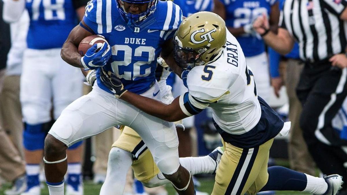 Duke’s Brittain Brown (22) carries the ball as Georgia Tech’s A.J. Gray (5) attempts a tackle during the first half their game Saturday.