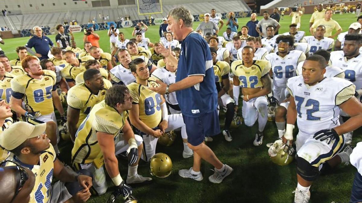 Georgia Tech head coach Paul Johnson, center, talks to his team after the Gold Team won over the White Team during the Yellow Jackets’ spring game Friday.