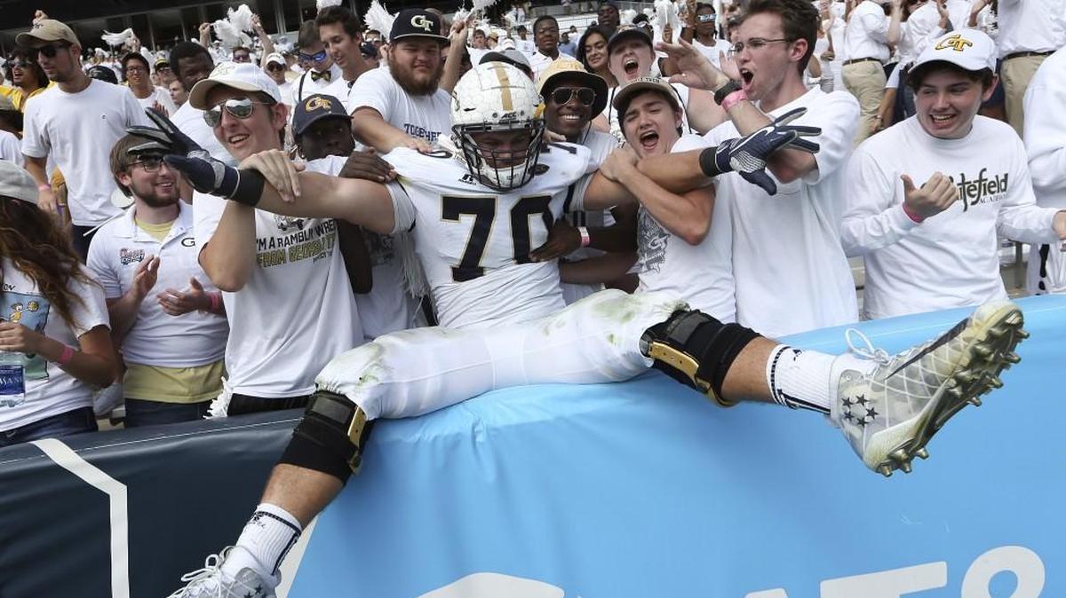 Georgia Tech offensive lineman Will Bryan (70) celebrates with fans after the Yellow Jackets beat North Carolina on Saturday.