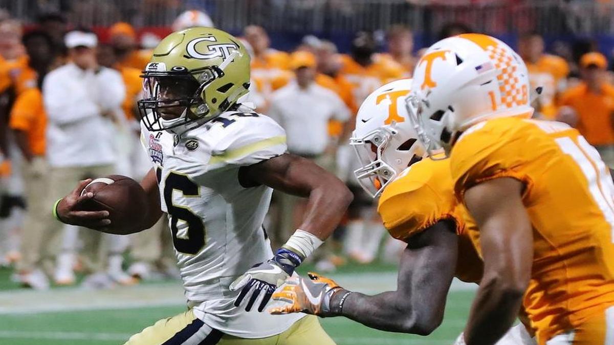 Georgia Tech quarterback TaQuon Marshall, left, scored five touchdowns against Tennessee on Monday.