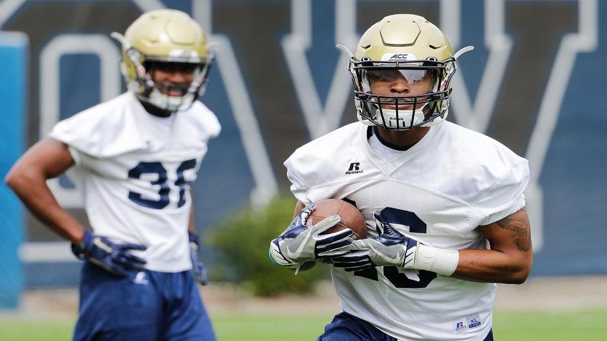 Georgia Tech quarterback TaQuon Marshall, right, runs a drill during practice last week.
