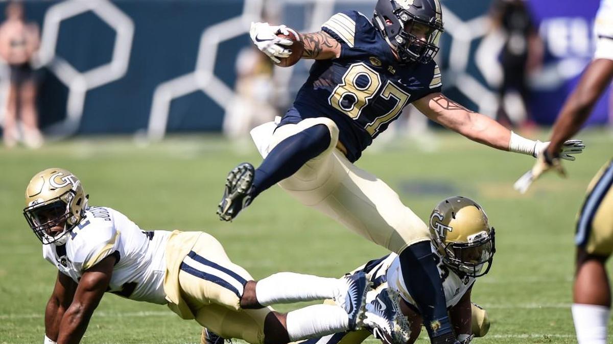 Georgia Tech linebacker Bruce Jordan-Swilling, left, and defensive back Jalen Johnson take down Pittsburgh tight end Chris Clark on Saturday.