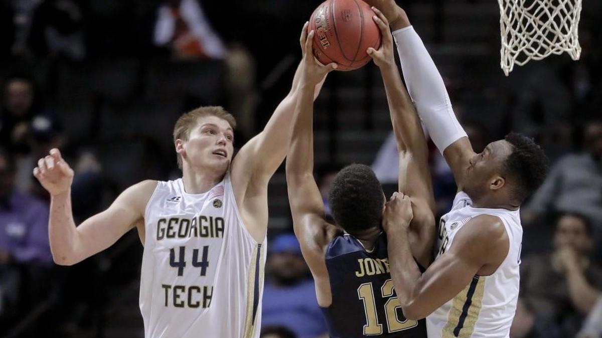Georgia Tech center Ben Lammers (44) and guard Josh Okogie (5) block a shot attempt by Pittsburgh guard Chris Jones (12) during the second half of an NCAA college basketball game in the first round of the ACC tournament, Tuesday, March 7, 2017, in New York. Pittsburgh won 61-59.