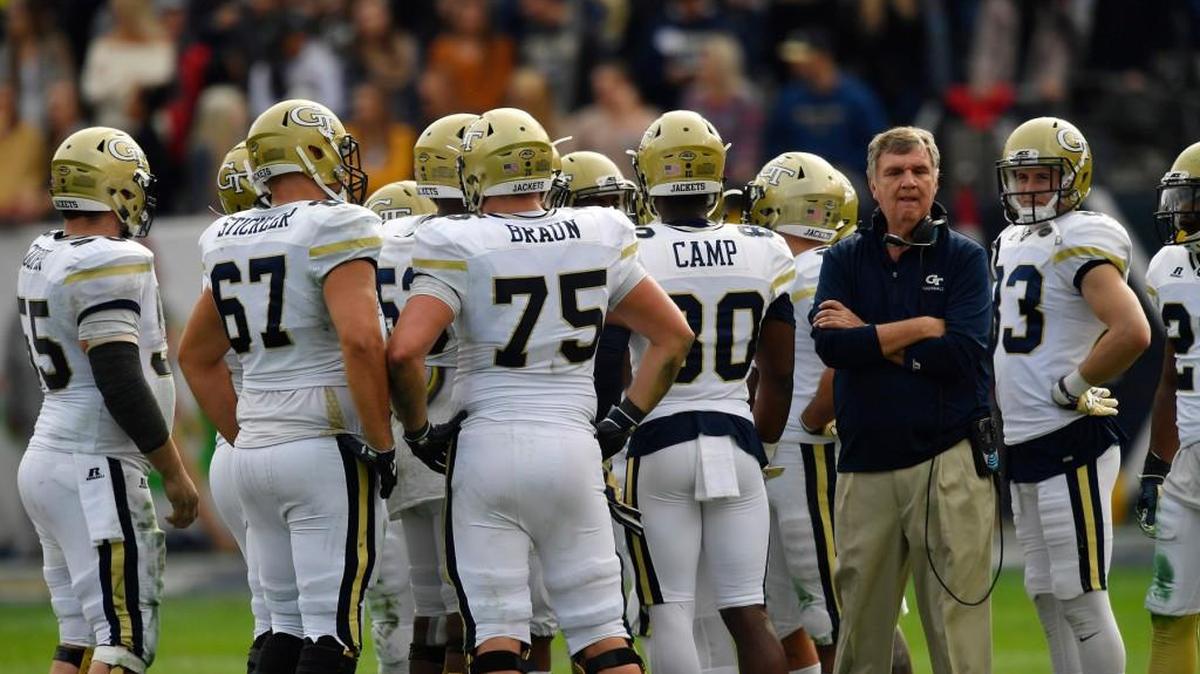 Georgia Tech head coach Paul Johnson stands in huddle against Georgia during the first half of their game Nov. 25, 2017, in Atlanta.