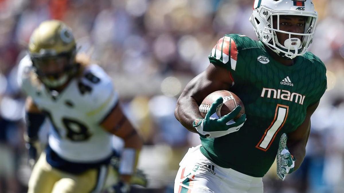 Miami running back Mark Walton (1) runs toward the end zone against Georgia Tech during the first half of Saturday’s ACC game.