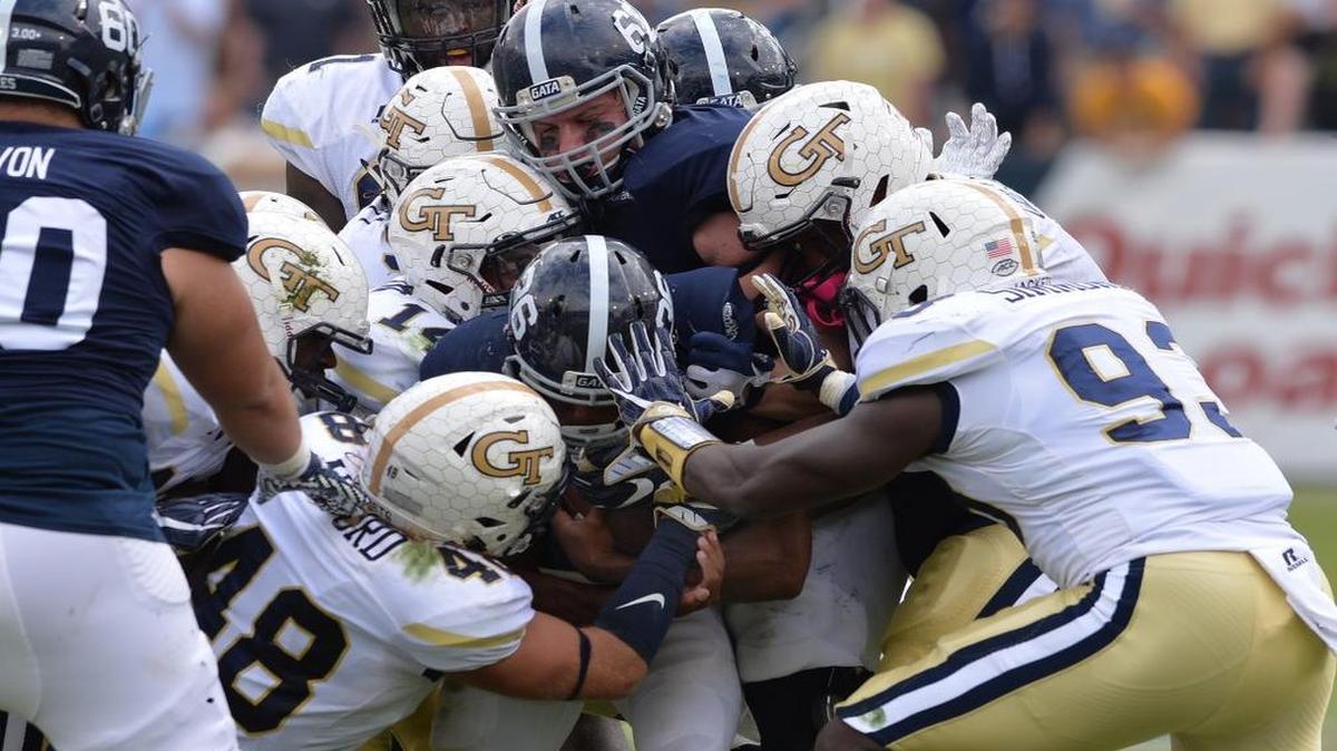 Georgia Southern’s Matt Breida is surrounded at the line of scrimmage by a host of Georgia Tech defenders during Saturday’s game.