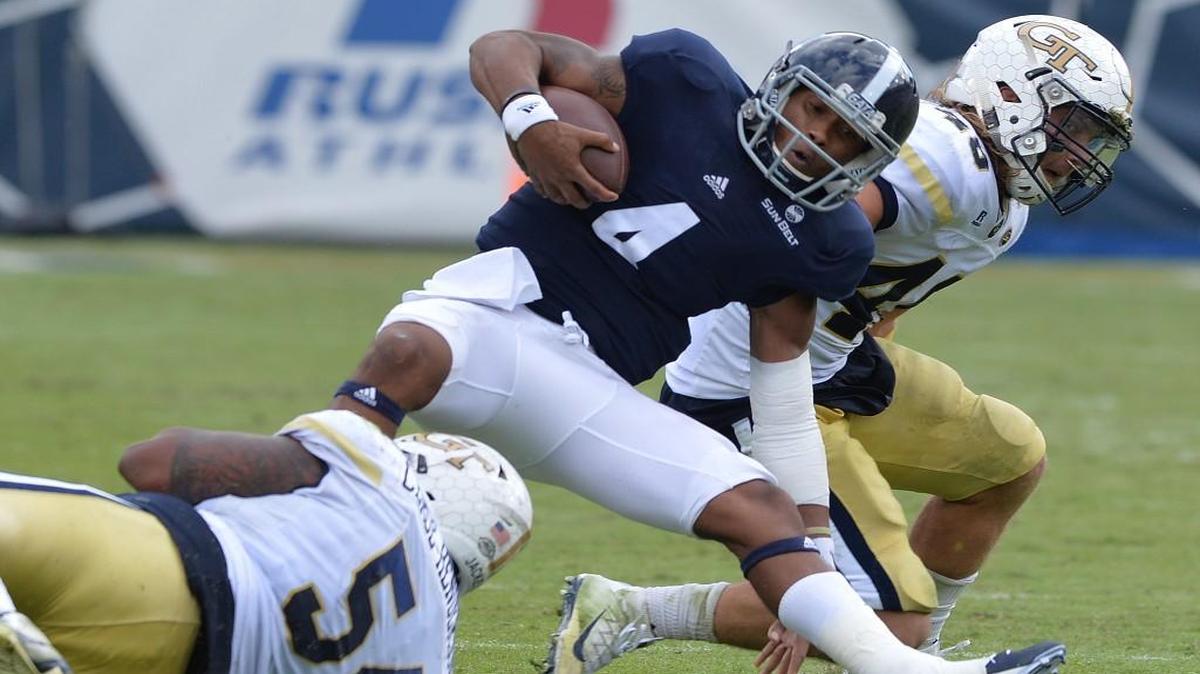 Georgia Southern quarterback Kevin Ellison (4) is hauled down by Georgia Tech defender Kyle Cerge-Henderson on Saturday at Bobby Dodd Stadium.
