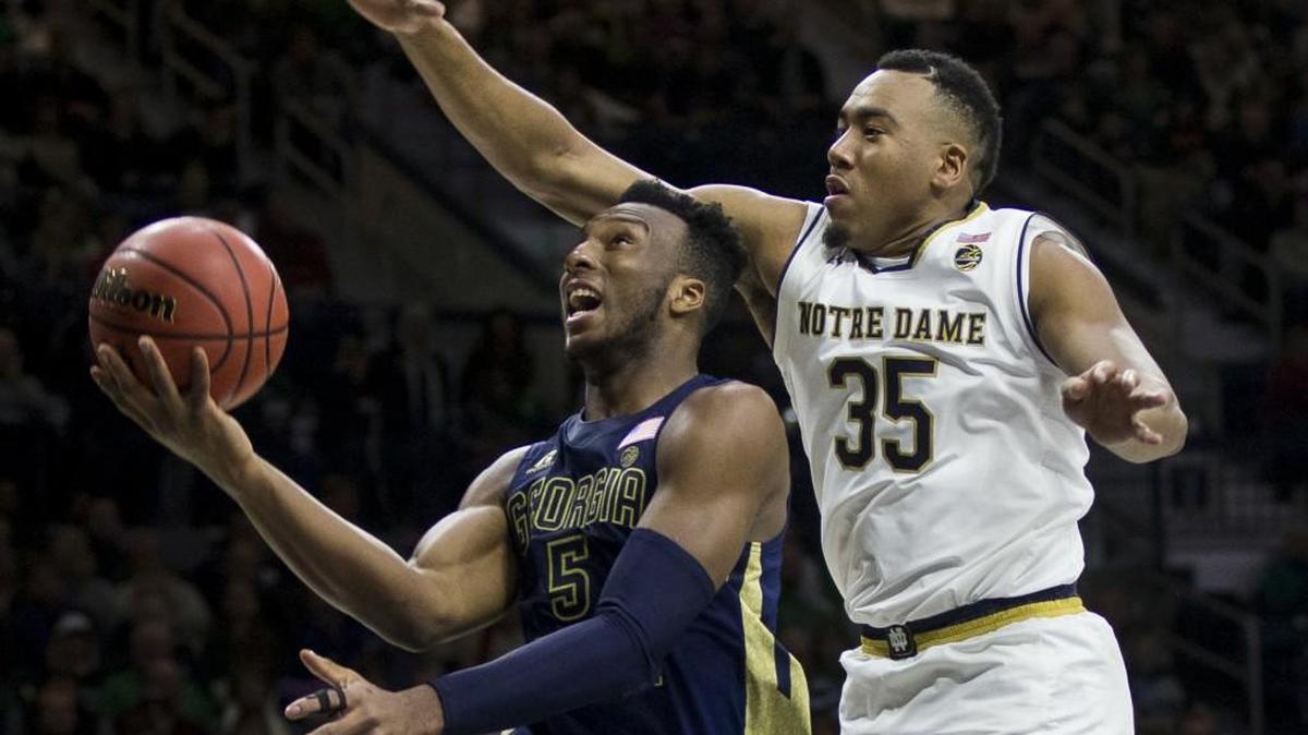 Georgia Tech's Josh Okogie (5) goes up to shoot as Notre Dame's Bonzie Colson (35) defends during the first half of an NCAA college basketball game Saturday, Dec. 30, 2017, in South Bend, Ind.
