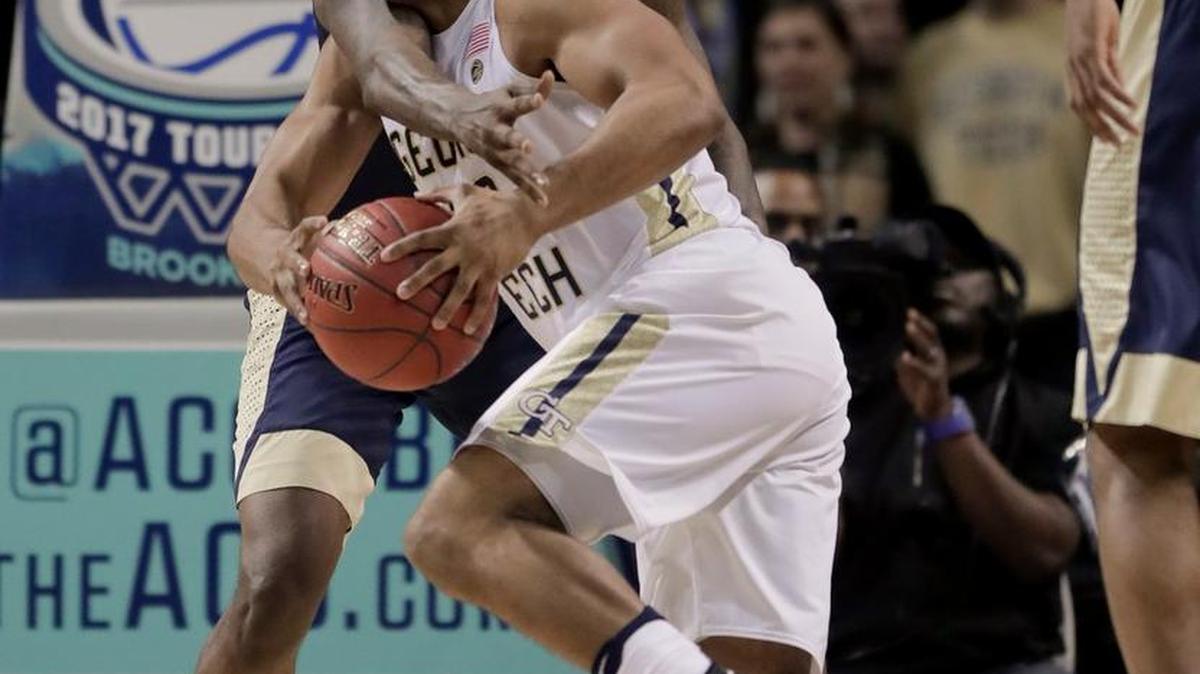 Georgia Tech guard Corey Heyward (30) drives against Pittsburgh forward Jamel Artis (1) during the first half of their ACC Tournament first-round game, won 61-59 by Pittsburgh on Tuesday, March 7, 2017, in New York.