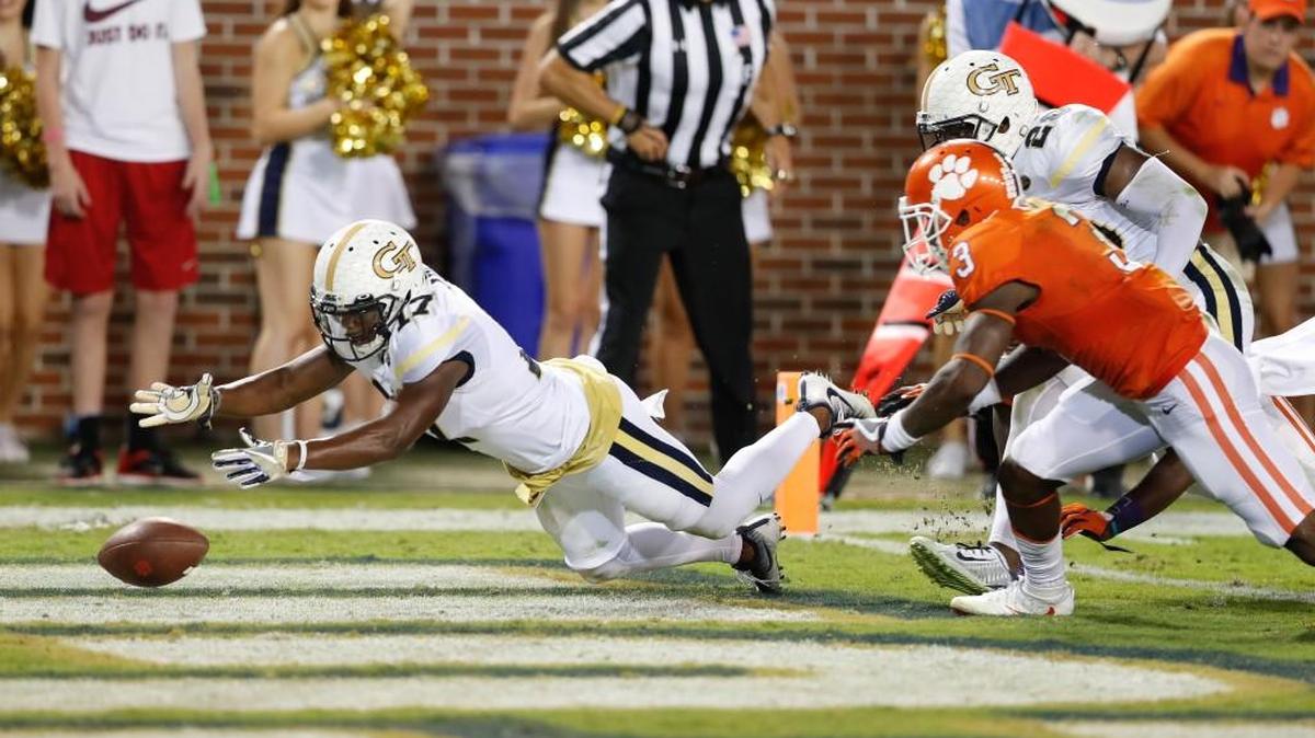 Georgia Tech defensive back Lance Austin (17) fumbles the ball into the end zone after intercepting a pass in the first half of an NCAA college football game against Clemson on Thursday in Atlanta. Austin recovered the ball but was ruled down in the end zone for a safety.