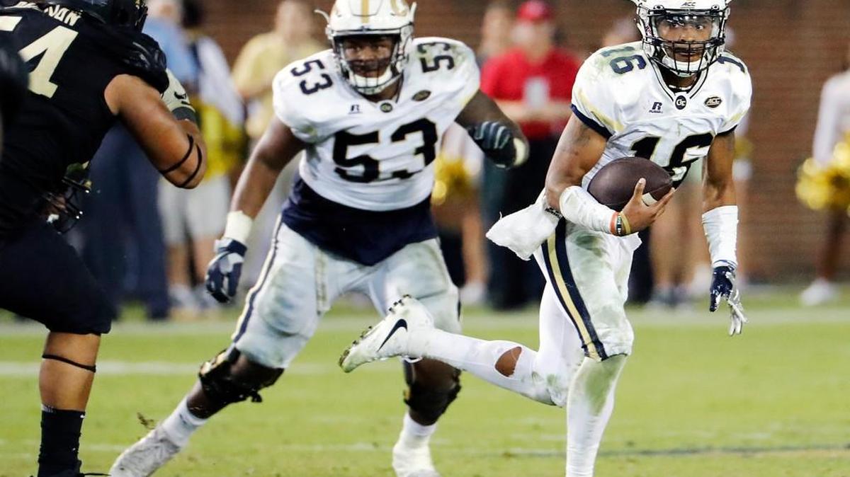Georgia Tech quarterback TaQuon Marshall, right, leads the ACC in rushing yards per game.