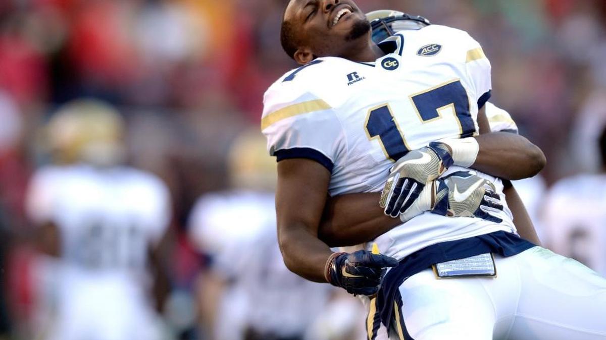 Georgia Tech defensive back and Lamar County product Lance Austin (17) gets lifted in the air by a teammate after the Yellow Jackets’ victory Saturday at Georgia.