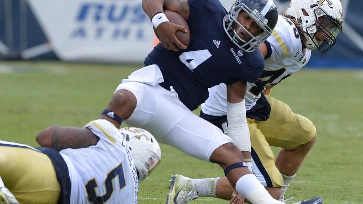 Georgia Southern quarterback Kevin Ellison (4) is hauled down by Georgia Tech defender Kyle Cerge-Henderson on Saturday at Bobby Dodd Stadium.